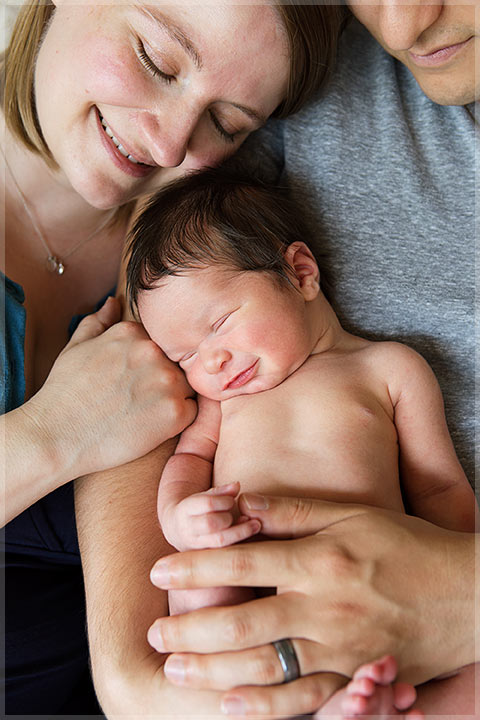 newborn smiling artistic crop
