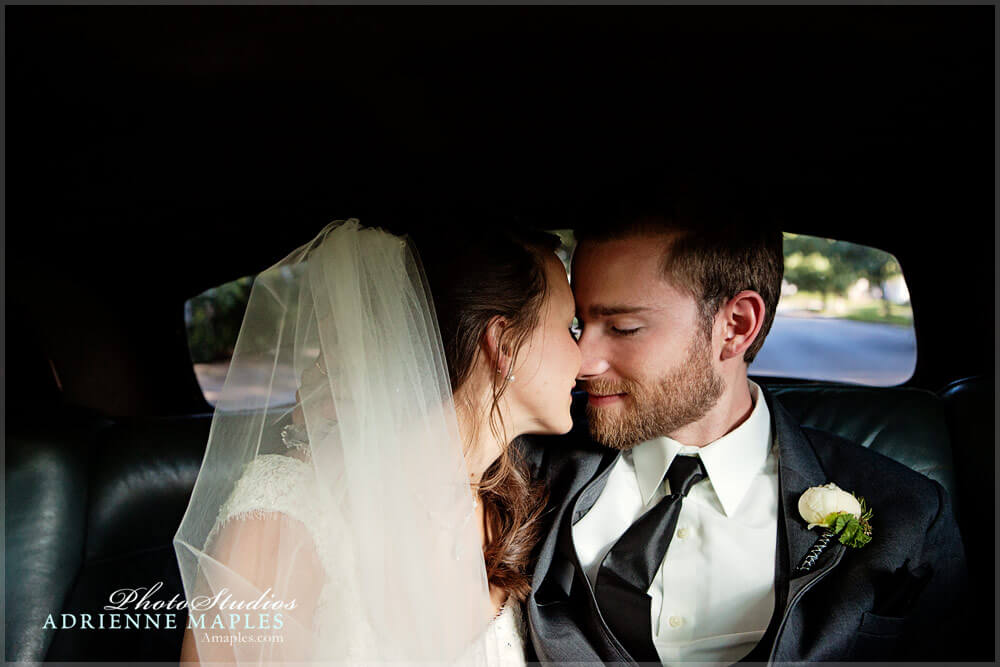 photo moment bride groom kiss in car