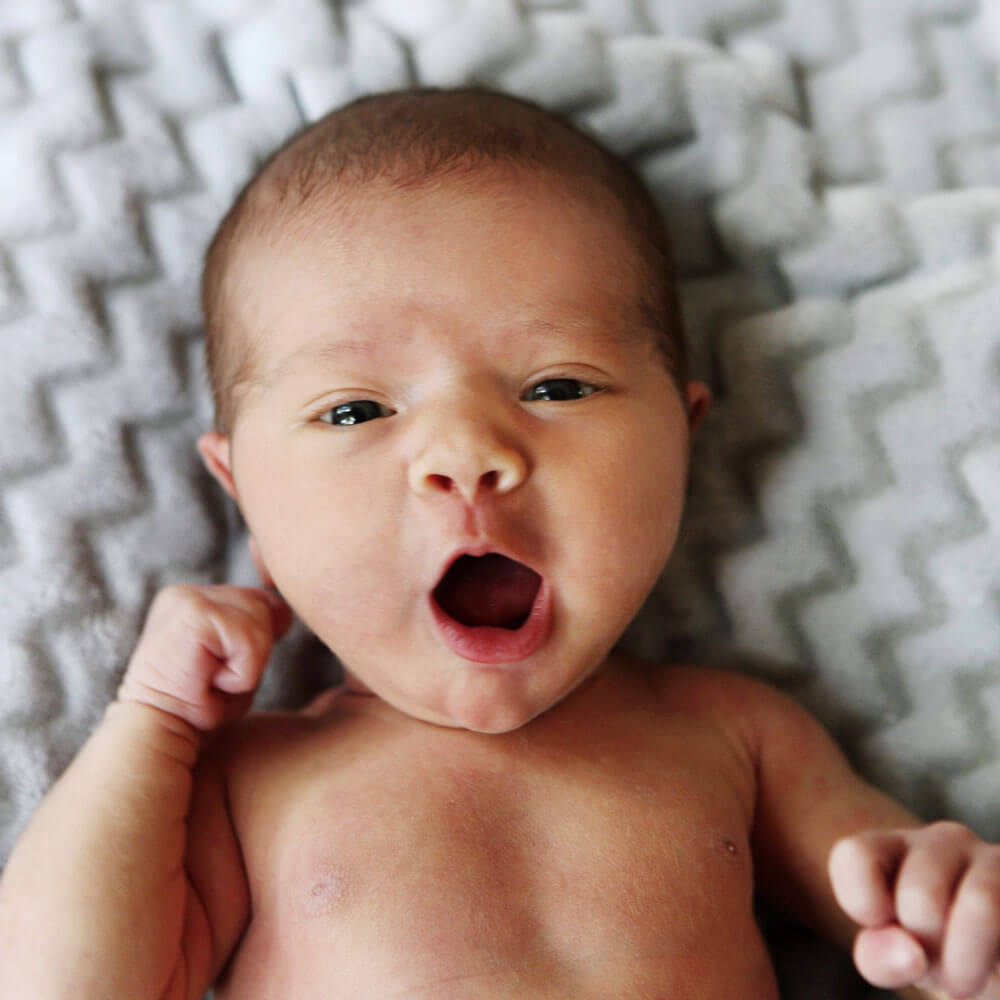 newborn baby yawning
