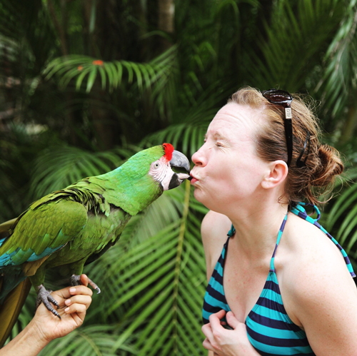 adrienne maples kissing a parrot